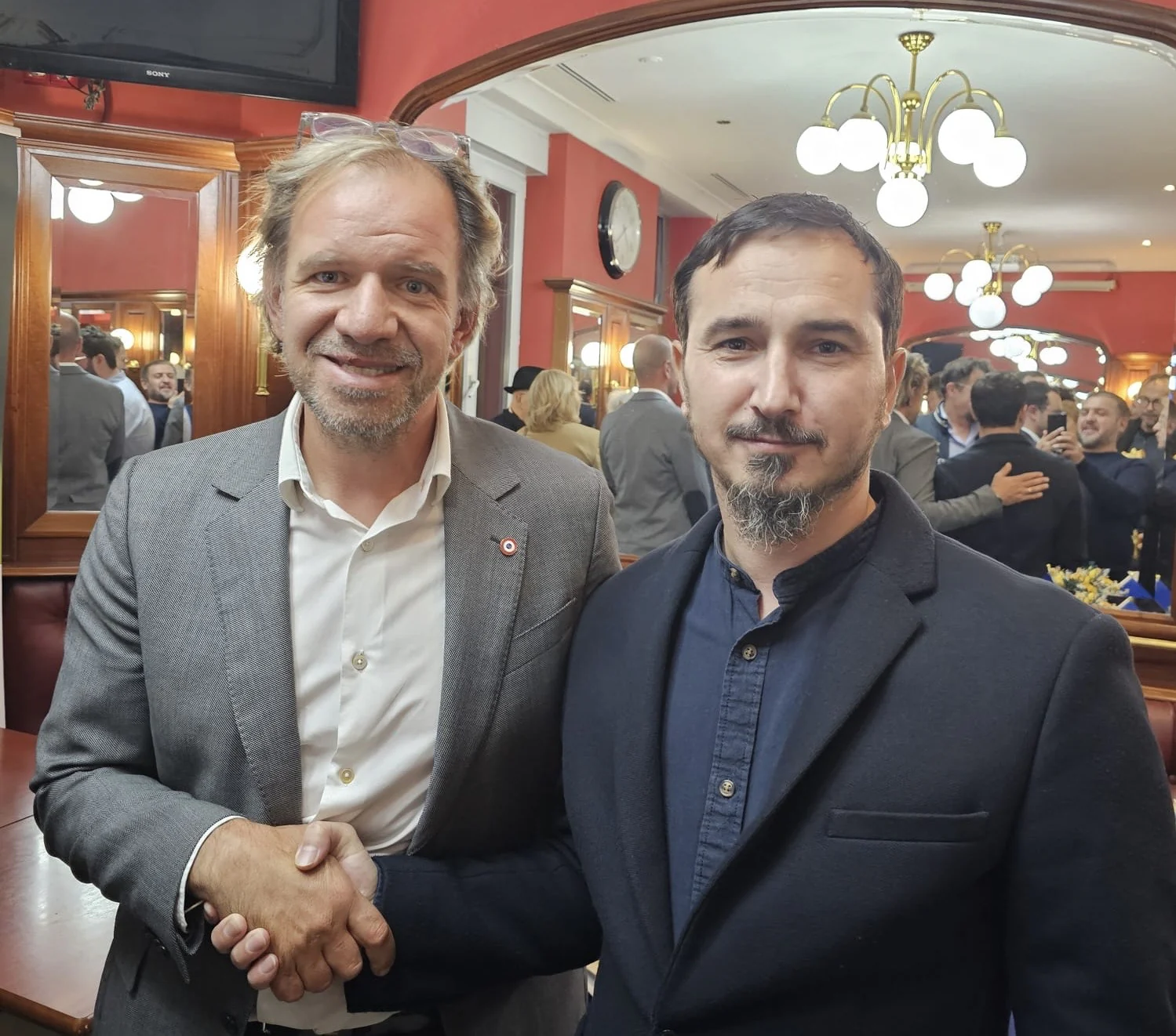 Arsen Madiev at a public meeting with a French parliamentarian